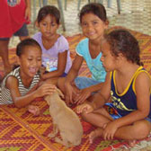 smiling students and puppy